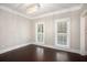 Bright bedroom with wood floors and two sunny windows is a relaxing space at 194 Preston Nw Pl, Dallas, GA 30157