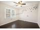 Bedroom featuring wood floors, neutral paint and a sunny window at 194 Preston Nw Pl, Dallas, GA 30157