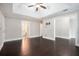 Hardwood floors, neutral paint, bright lighting, and open doorway features in spacious bedroom at 194 Preston Nw Pl, Dallas, GA 30157
