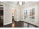 Dining area with dark hardwood floors, French doors to the outside, and modern lighting at 194 Preston Nw Pl, Dallas, GA 30157