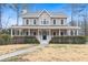 Charming home featuring a welcoming front porch and manicured landscaping at 194 Preston Nw Pl, Dallas, GA 30157