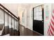 Welcoming foyer with hardwood floors, staircase and a glimpse into other rooms at 194 Preston Nw Pl, Dallas, GA 30157