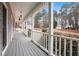 Expansive covered porch showcasing serene neighborhood views and white railings at 194 Preston Nw Pl, Dallas, GA 30157