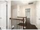 Bright hallway features hardwood floors, staircase with dark wood railing, and neutral paint at 194 Preston Nw Pl, Dallas, GA 30157