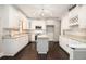 Bright eat-in kitchen boasts white cabinetry, stainless steel appliances and granite countertops at 194 Preston Nw Pl, Dallas, GA 30157
