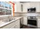 This kitchen offers granite countertops, stainless appliances and great lighting at 194 Preston Nw Pl, Dallas, GA 30157