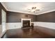 Spacious living room with dark hardwood floors, fireplace, and ample natural light at 194 Preston Nw Pl, Dallas, GA 30157