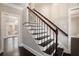 Staircase with wood and iron banister leading to upper level of home at 194 Preston Nw Pl, Dallas, GA 30157