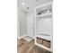 The mudroom features a built-in bench with storage baskets, hooks, and hardwood floors at 2000 Cortland Rd, Alpharetta, GA 30009