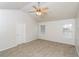 Neutral bedroom features a ceiling fan and great natural light at 5792 Village Loop, Fairburn, GA 30213