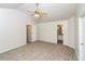 Bedroom with vaulted ceiling, carpet flooring, and ensuite bathroom at 5792 Village Loop, Fairburn, GA 30213