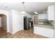 Bright kitchen with tile floors, modern appliances, and granite countertops at 5792 Village Loop, Fairburn, GA 30213
