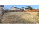 Wide shot of the backyard showing a huge yard with a wooden fence for privacy at 2126 Sawgrass Dr, Hampton, GA 30228