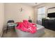 Bedroom featuring neutral walls, a window letting in natural light, and a comfortable bed at 2126 Sawgrass Dr, Hampton, GA 30228