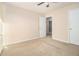 This bedroom is well lit, with light beige carpet and light beige walls, perfect for relaxation at 2126 Sawgrass Dr, Hampton, GA 30228