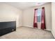 This bedroom is well lit, with light beige carpet and light beige walls, perfect for relaxation at 2126 Sawgrass Dr, Hampton, GA 30228