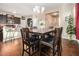 Inviting dining area with table and chairs, open to the kitchen with natural light at 2126 Sawgrass Dr, Hampton, GA 30228