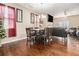 Open concept dining area with hardwood floors, and views of the living room at 2126 Sawgrass Dr, Hampton, GA 30228