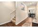 Inviting foyer with hardwood floors, staircase, and view to dining area at 2126 Sawgrass Dr, Hampton, GA 30228