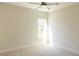 Bedroom featuring neutral carpet, a ceiling fan, and a window with natural light at 464 Eager Ct, Marietta, GA 30064