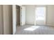 Cozy bedroom with soft carpeting, a large window, and a spacious closet at 464 Eager Ct, Marietta, GA 30064