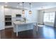 Bright kitchen with stainless steel appliances, white cabinets, and a spacious island at 464 Eager Ct, Marietta, GA 30064