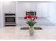 Bright kitchen featuring stainless steel appliances, quartz countertops, and a large island with sink at 464 Eager Ct, Marietta, GA 30064