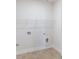 Laundry room with tile floors, shelf, and hookups at 464 Eager Ct, Marietta, GA 30064