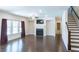 Bright living room featuring hardwood floors, fireplace, and large windows for natural light at 464 Eager Ct, Marietta, GA 30064