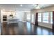 Open-concept living space with hardwood floors, modern lighting, and a view of the kitchen area at 464 Eager Ct, Marietta, GA 30064