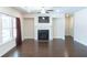 Inviting living room featuring hardwood floors, fireplace, and large windows for natural light at 464 Eager Ct, Marietta, GA 30064