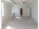 Large main bedroom with tray ceilings, recessed lighting, and an ensuite bathroom at 464 Eager Ct, Marietta, GA 30064