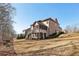 Beautiful home featuring a brick exterior, screened porch, and a spacious backyard at 4520 Valence Dr, Cumming, GA 30040