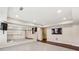Finished basement featuring mirrored wall, dark hardwood floors, and recessed lighting at 4520 Valence Dr, Cumming, GA 30040