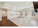 Spacious basement featuring hardwood floors, multiple windows and recessed lighting at 4520 Valence Dr, Cumming, GA 30040