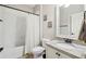 Bright bathroom features a shower-tub combination and granite countertop vanity with white cabinets at 4520 Valence Dr, Cumming, GA 30040