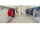 Spacious walk-in closet features organized racks for ample clothing storage at 4520 Valence Dr, Cumming, GA 30040