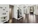 Elegant foyer featuring hardwood floors, a staircase, and a view of the front entrance at 4520 Valence Dr, Cumming, GA 30040