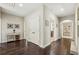 Hallway with wood flooring and decorative console table with decor accents at 4520 Valence Dr, Cumming, GA 30040