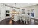 Bright kitchen featuring a large island, granite countertops, stainless steel appliances, and eat-in area at 4520 Valence Dr, Cumming, GA 30040