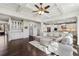 Open-concept living room and kitchen with hardwood floors and coffered ceiling at 4520 Valence Dr, Cumming, GA 30040
