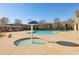 Community swimming pool with a splash pad and lounge area at 4520 Valence Dr, Cumming, GA 30040