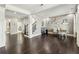Spacious living area with hardwood floors and adjacent stairs at 4520 Valence Dr, Cumming, GA 30040