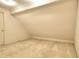 Attic space with carpeted floor and angled ceiling at 3889 Pineybrook Dr, Loganville, GA 30052