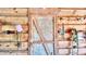 Interior view of a barn, showcasing the wood construction and a rustic door at 3889 Pineybrook Dr, Loganville, GA 30052