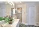 Bathroom featuring tile flooring, dual sink vanity, a shower, and a linen closet at 3889 Pineybrook Dr, Loganville, GA 30052