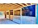 A covered horse stable, featuring multiple stalls with wood and metal construction at 3889 Pineybrook Dr, Loganville, GA 30052