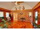 Relaxing living room area with wood paneled walls, a statement floor, and a vaulted ceiling at 3889 Pineybrook Dr, Loganville, GA 30052