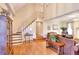 Inviting living room with hardwood floors, a staircase, and comfortable seating at 3889 Pineybrook Dr, Loganville, GA 30052