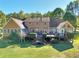 A spacious home featuring a large deck surrounded by lush landscaping, perfect for outdoor living at 3889 Pineybrook Dr, Loganville, GA 30052